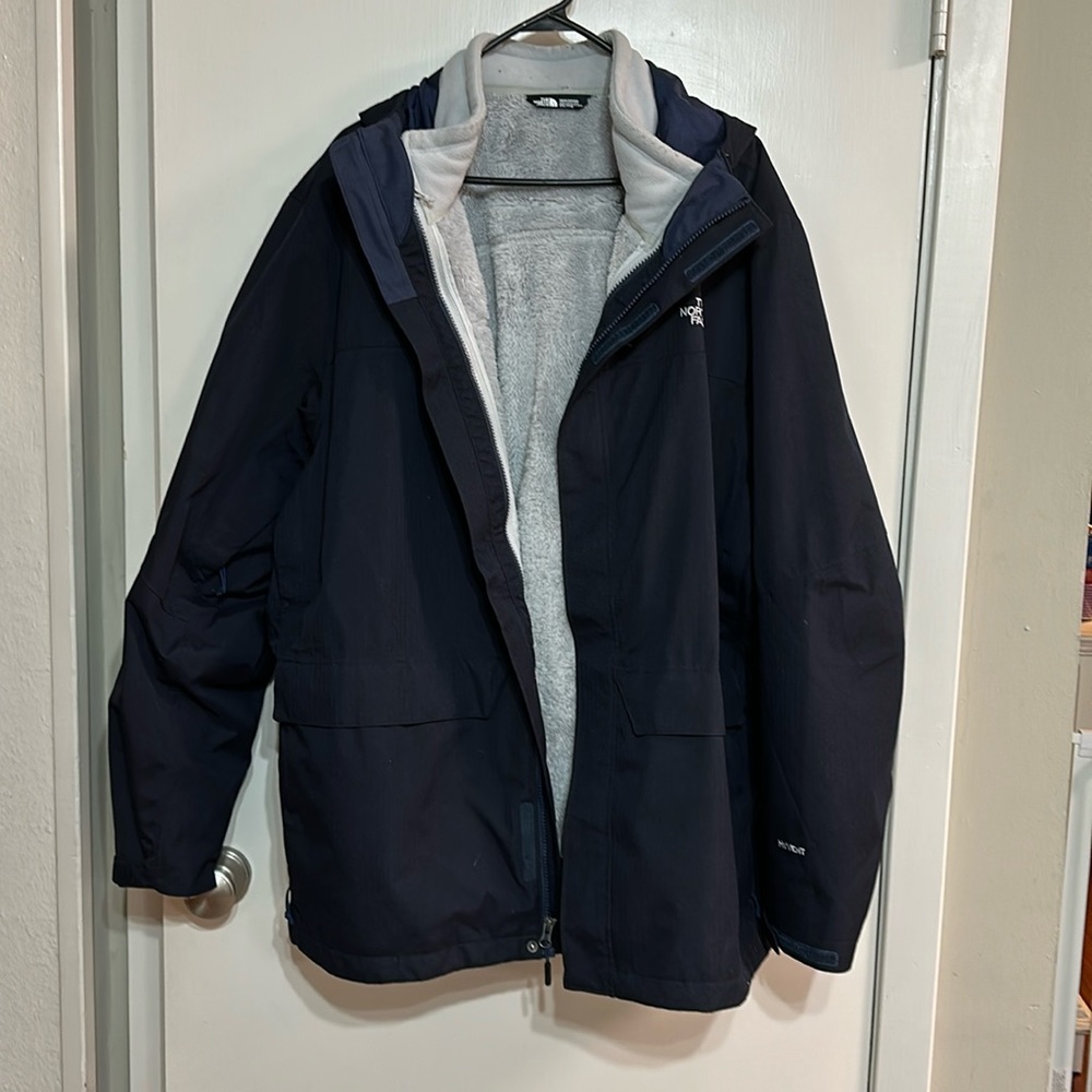 The North Face 3in1 Navy jacket. Fleece inner jacket is silver/grey. Mildly used